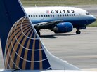 A United Airlines aircraft passes by a Continental Airlines plane at Ronald Reagan Washington National Airport in 2006. Their merger, begun in 2010, has been difficult, analysts say. A United Airlines aircraft passes by a Continental Airlines plane at Ronald Reagan Washington National Airport in 2006. Their merger, begun in 2010, has been difficult, analysts say.
