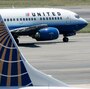 A United Airlines aircraft passes by a Continental Airlines plane at Ronald Reagan Washington National Airport in 2006. Their merger, begun in 2010, has been difficult, analysts say. A United Airlines aircraft passes by a Continental Airlines plane at Ronald Reagan Washington National Airport in 2006. Their merger, begun in 2010, has been difficult, analysts say.