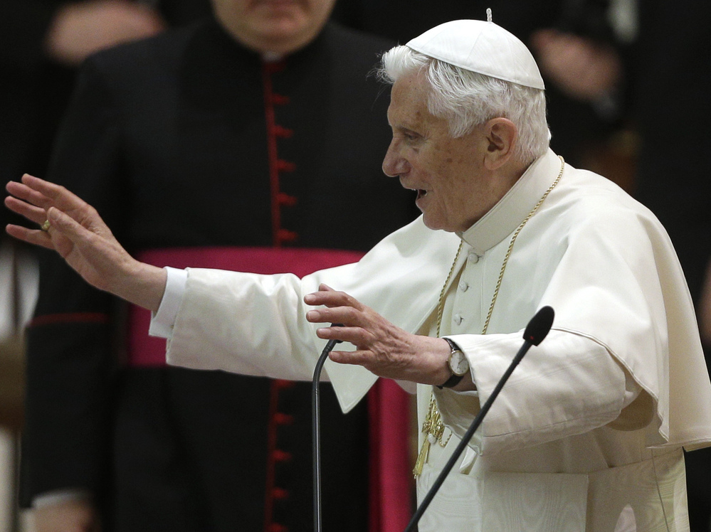 Pope Benedict XVI delivers his blessing after an audience with the Roman clergy in the Paul VI Hall at the Vatican on Thursday.