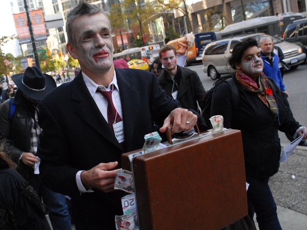 Canadian zombies dress for success. (An Occupy Vancouver "Zombie Walk" in October 2011.)