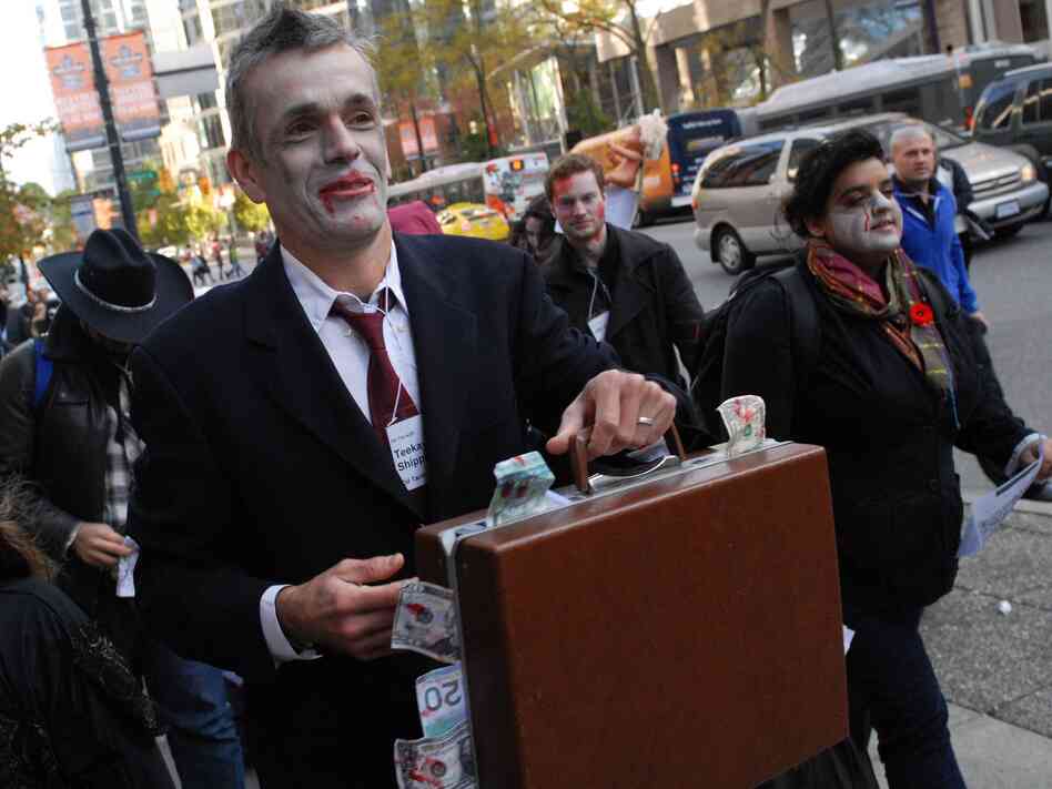 Canadian zombies dress for success. (An Occupy Vancouver "Zombie Walk" in October 2011.)