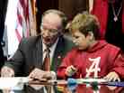 Ala. Gov. Robert Bentley colors with 6-year-old Ethan in a visit to the governor's office on Wednesday, Feb. 13, 2013.