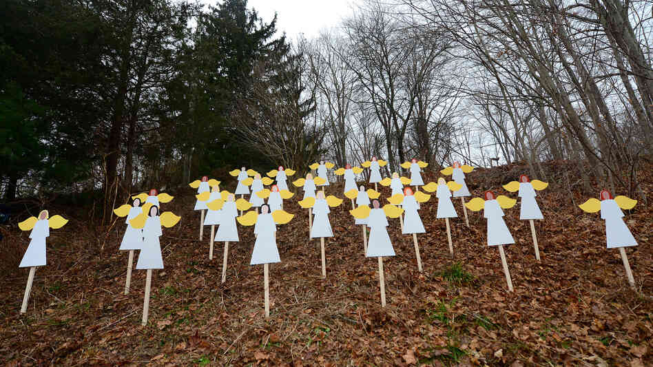 Wooden angels memorialize the victims of Adam Lanza's shooting spree in Newtown, Conn., last December. An upcoming Frontline documentary seeks to provide new details about Lanza and his mother, Nancy.