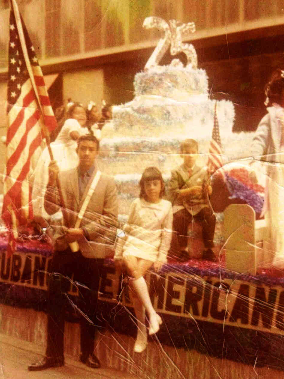 George Prendes (left), with siblings Mercedes and Roberto at a Cuban-American parade in New York in the early 1970s. The family spent their savings trying to assist George after his arrest.