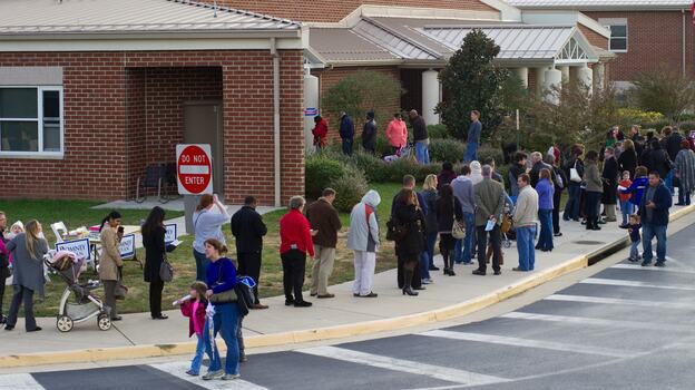 Voters wait in long lines to cast their ballots on Nov. 6 at Victory Elementary School in Bristow, Va.