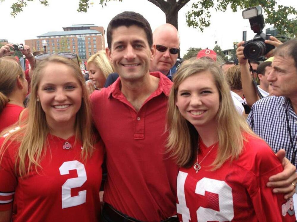 Ohio State University College Republicans Erin Miller (left) and Maggie Rochon (right) pose with former vice presidential candidate Paul Ryan before a game against Miami in September.