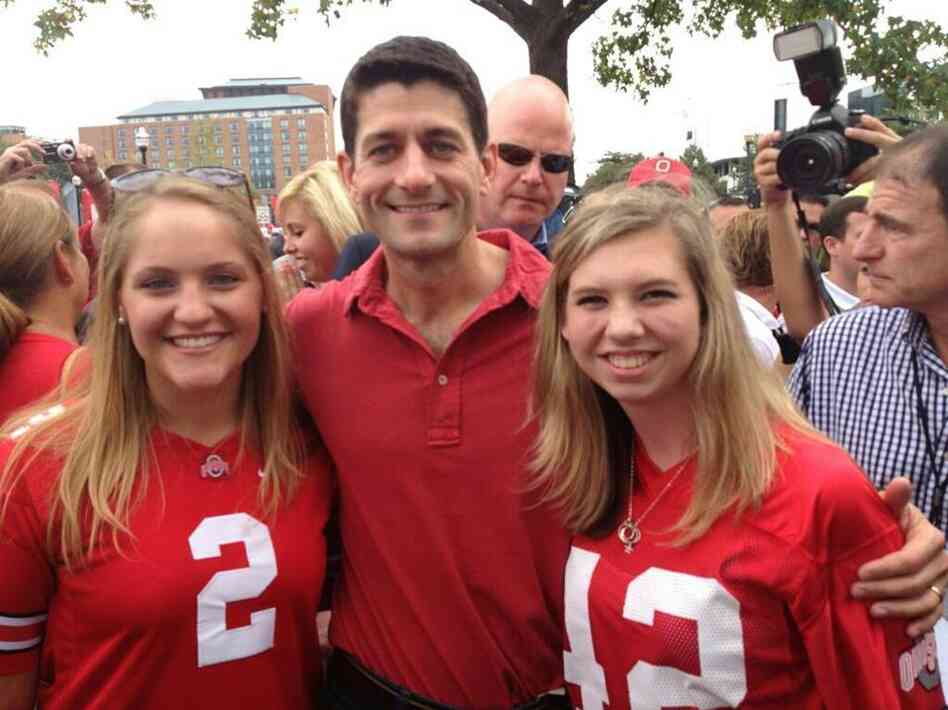 Ohio State University College Republicans Erin Miller (left) and Maggie Rochon (right) pose with former vice presidential candidate Paul Ryan before a game against Miami in September.