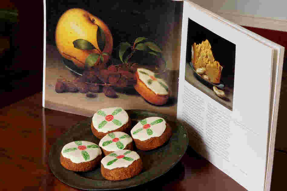 Cakes displayed with a reproduction of Raphaelle Peale's Still Life with Cake, from circa 1822.