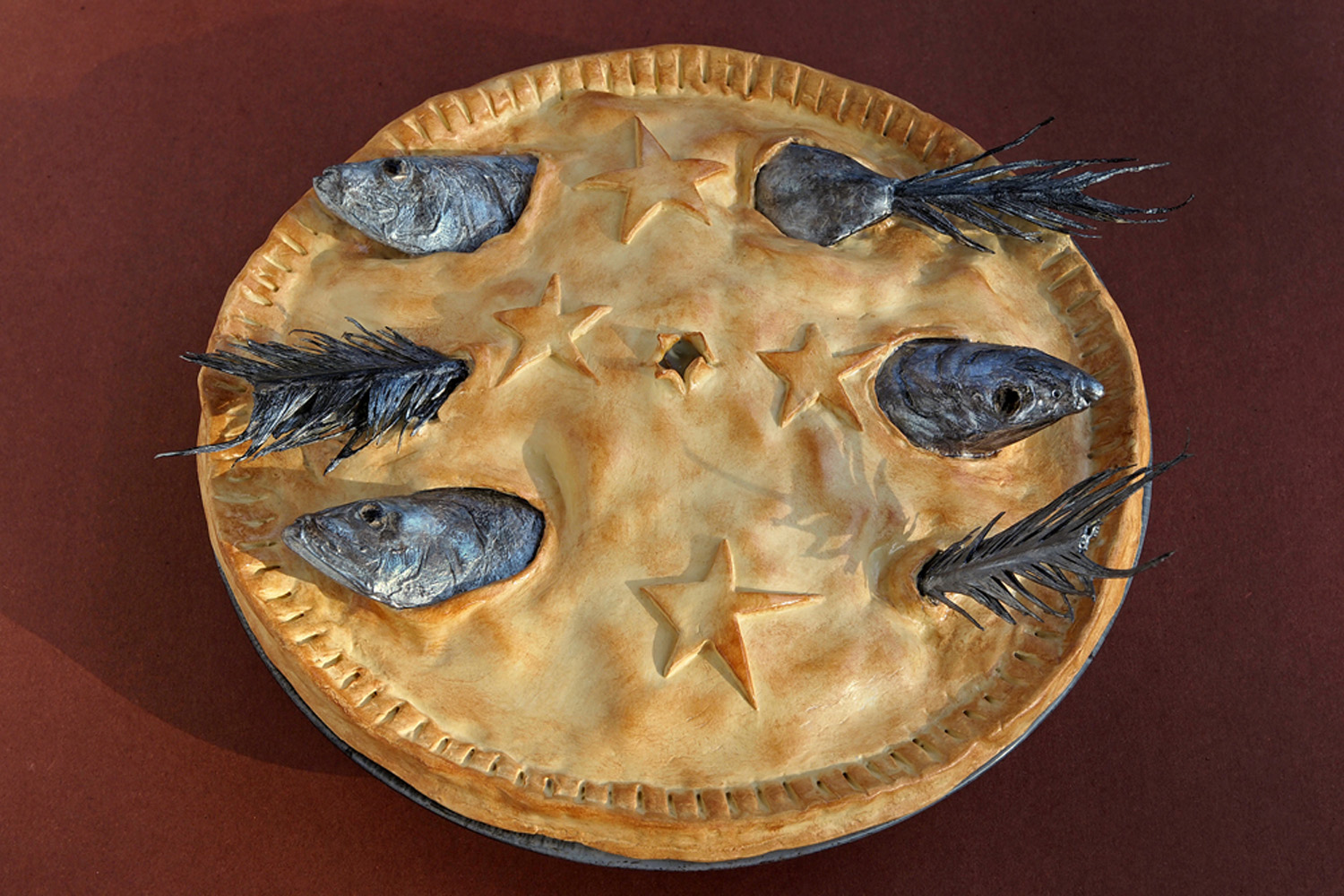 Stargazy Pie, a Cornish dish named for the way the fish heads poke through the crust towards the sky. Stargazy Pie, a Cornish dish named for the way the fish heads poke through the crust towards the sky.