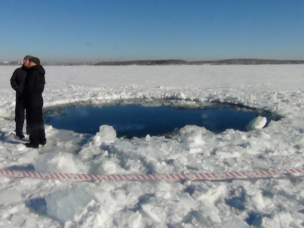 A hole in the ice of Chebarkul Lake where a meteor reportedly struck the lake near Chelyabinsk, about 930 miles east of Moscow