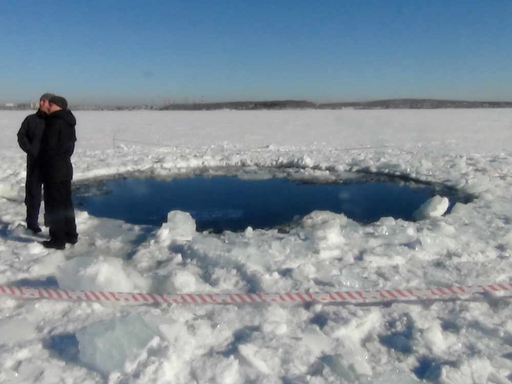 A hole in the ice of Chebarkul Lake where a meteor reportedly struck the lake near Chelyabinsk, about 930 miles east of Moscow