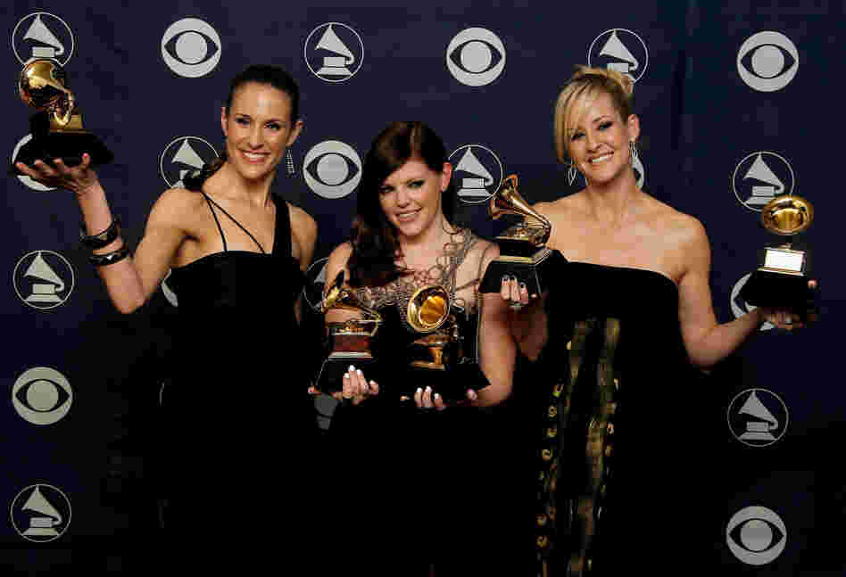 The members of The Dixie Chicks, (from left) Emily Robinson, Natalie Maines and Martie Maguire pose with their Grammys for Record of the Year, Album of the Year, Song of the Year, Best Country Performance by a Duo or Group with Vocal and Best Country Album.