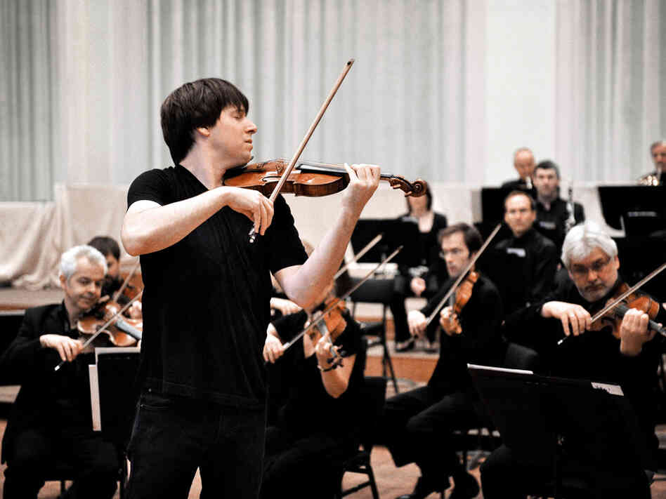 Violinist Joshua Bell conducts the Academy of St. Martin in the Fields by doing what comes naturally to him. The celebrated soloist is also the London orchestra's music director.