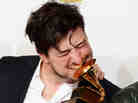 Marcus Mumford of Mumford & Sons, winner of Album of the Year at the 2013 Grammy Awards. To date, the band's winning album, Babel, has sold 1,737,000 copies, according to Nielsen Soundscan.