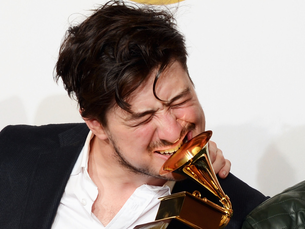 Marcus Mumford of Mumford & Sons, winner of Album of the Year at the 2013 Grammy Awards. To date, the band's winning album, Babel, has sold 1,737,000 copies, according to Nielsen Soundscan.