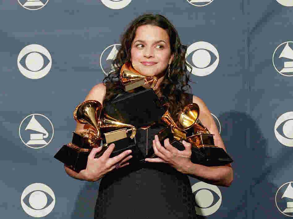 Norah Jones poses with her five Grammy Awards for Best Pop Vocal Album, Best Female Pop Vocal Performance, Album of the Year, Record of the Year and Best New Artist at the 45th Annual Grammy Awards.