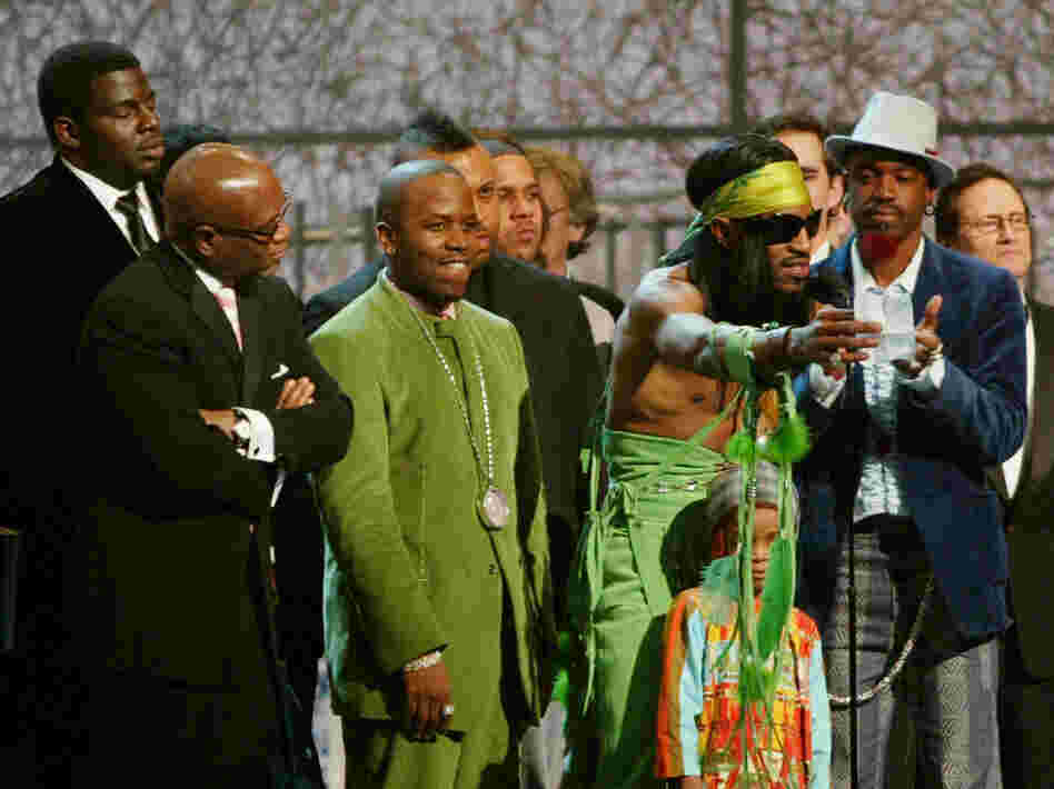 Andre 3000 (at microphone) and Big Boi of OutKast accept the Grammy for Album of the Year at the 46th Annual Grammy Awards.