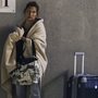 After finally getting off the Carnival cruise ship Triumph, this passenger waited for a ride early Friday in Mobile, Ala. After finally getting off the Carnival cruise ship Triumph, this passenger waited for a ride early Friday in Mobile, Ala.