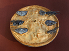 Stargazy Pie, a cornish dish named for the way the fish heads poke through the crust towards the sky. Stargazy Pie, a cornish dish named for the way the fish heads poke through the crust towards the sky.