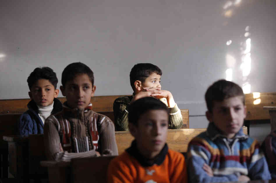 Children attend school in Aleppo in November.