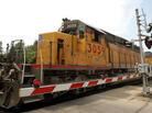 A Union Pacific freight train passes over a grade crossing in Elmhurst, Ill. A Union Pacific freight train passes over a grade crossing in Elmhurst, Ill.