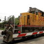 A Union Pacific freight train passes over a grade crossing in Elmhurst, Ill. A Union Pacific freight train passes over a grade crossing in Elmhurst, Ill.