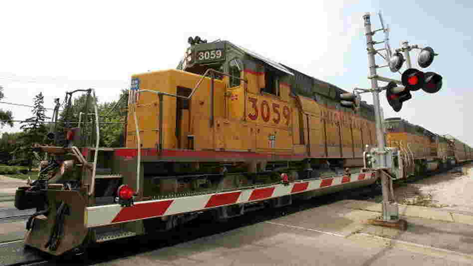 A Union Pacific freight train passes over a grade crossing in Elmhurst, Ill.