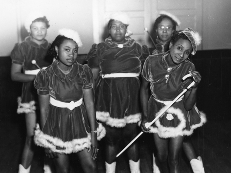 This 1942 photo provided by the Louisiana State Museum shows Gold Digger Baby Dolls, one of the neighborhood groups that adopted the "baby doll" costumes.