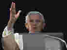 Pope Benedict XVI acknowledges a cheering crowd of faithful and pilgrims during the Angelus prayer from the window of his apartments at the Vatican on Sunday.
