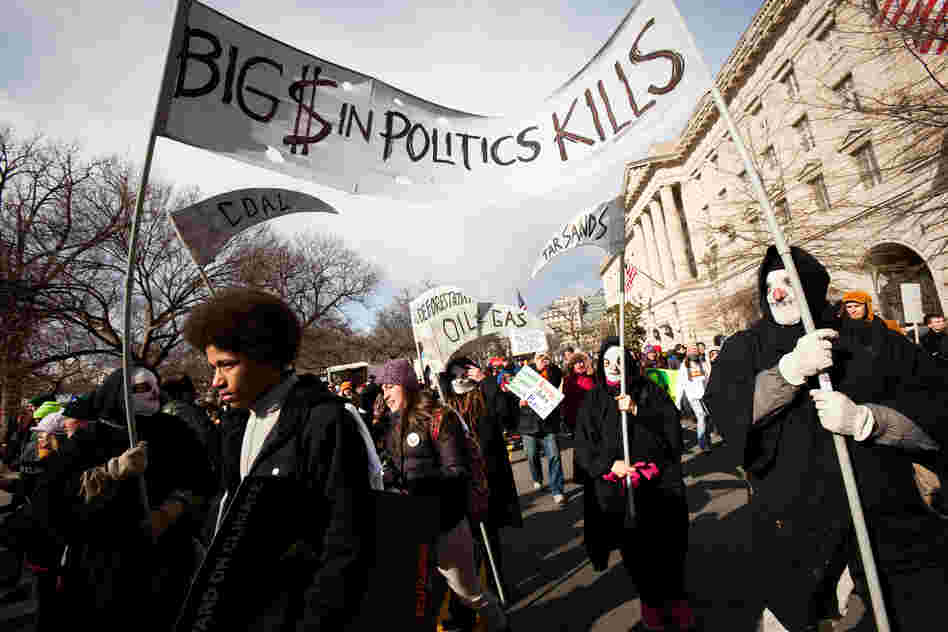 The Grim Reaper was a common theme, ranging from a costumed group to a cutout on a sign that read, "The only steady job on a dying planet will be mine"