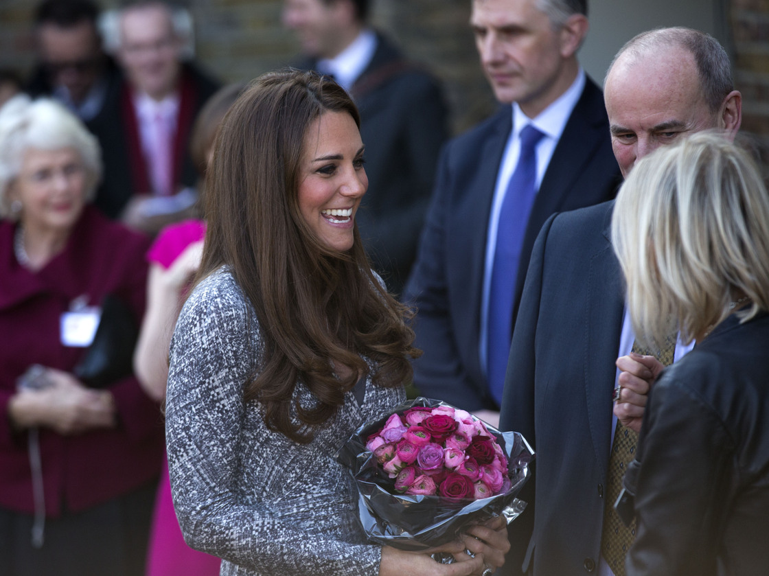 The Duchess of Cambridge receives a bouquet of flowers, as she leaves after a visit to Hope House in London on Tuesday. The former Kate Middleton appeared unaffected by the controversy surrounding remarks made by author Hilary Mantel.