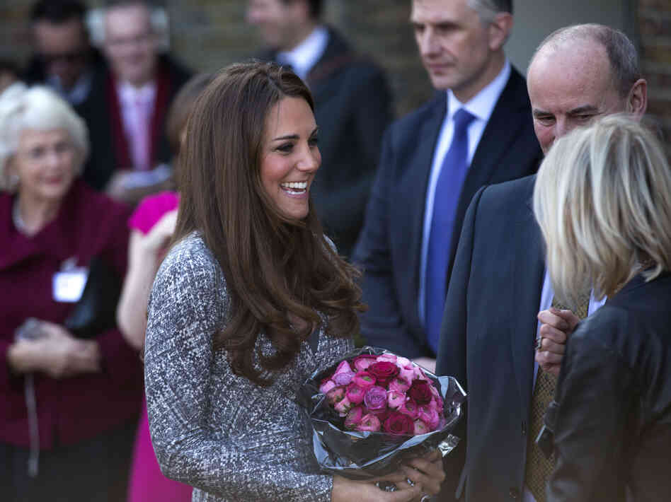 The Duchess of Cambridge receives a bouquet of flowers, as she leaves after a visit to Hope House in London on Tuesday. The former Kate Middleton appeared unaffected by the controversy surrounding remarks made by author Hilary Mantel.