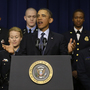 President Obama, accompanied by emergency responders — workers the White House says could be affected if state and local governments lose federal money as a result of budget cuts — speaks in the Eisenhower Executive Office building in Washington on Tuesday.