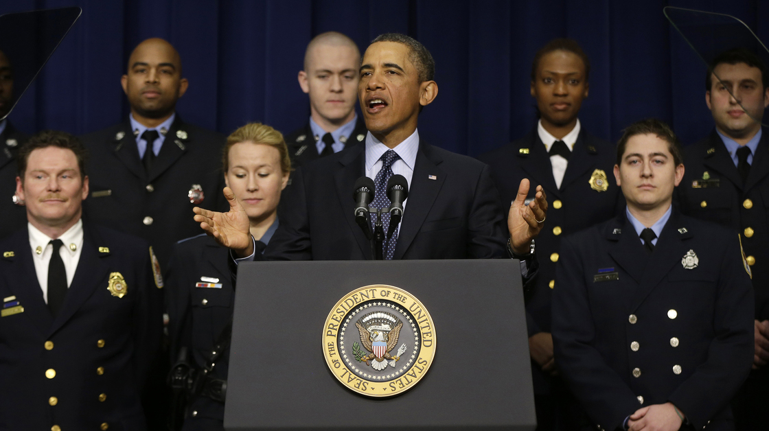 President Obama, accompanied by emergency responders — workers the White House says could be affected if state and local governments lose federal money as a result of budget cuts — speaks in the Eisenhower Executive Office building in Washington on Tuesday.