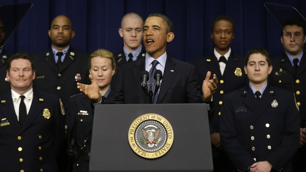 President Obama, accompanied by emergency responders — workers the White House says could be affected if state and local governments lose federal money as a result of budget cuts — speaks in the Eisenhower Executive Office building in Washington on Tuesday.