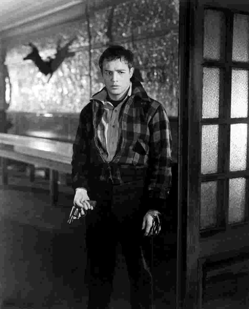 As dockworker Terry Malloy in Elia Kazan's On the Waterfront, a young Marlon Brando firmly established himself as a leading Hollywood icon.