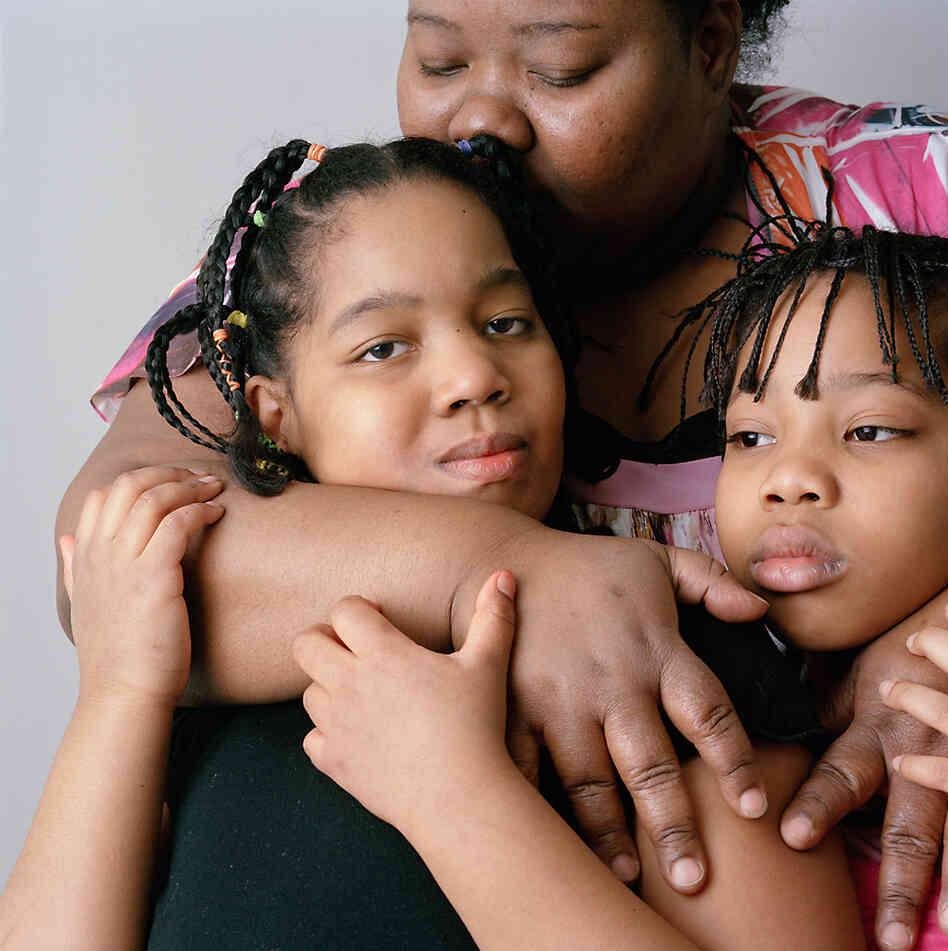 10-year-old girl with her mother and sister, 2011