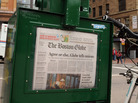 A Boston Globe newpaper sits inside a vendor box in 2009. A Boston Globe newpaper sits inside a vendor box in 2009.