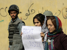 Students in Kabul protest violence against women in Kabul last fall. Afghan President Hamid Karzai issued a decree in 2009 protecting women's rights, but parliament has not passed a law making the decree permanent. Students in Kabul protest violence against women in Kabul last fall. Afghan President Hamid Karzai issued a decree in 2009 protecting women's rights, but parliament has not passed a law making the decree permanent.