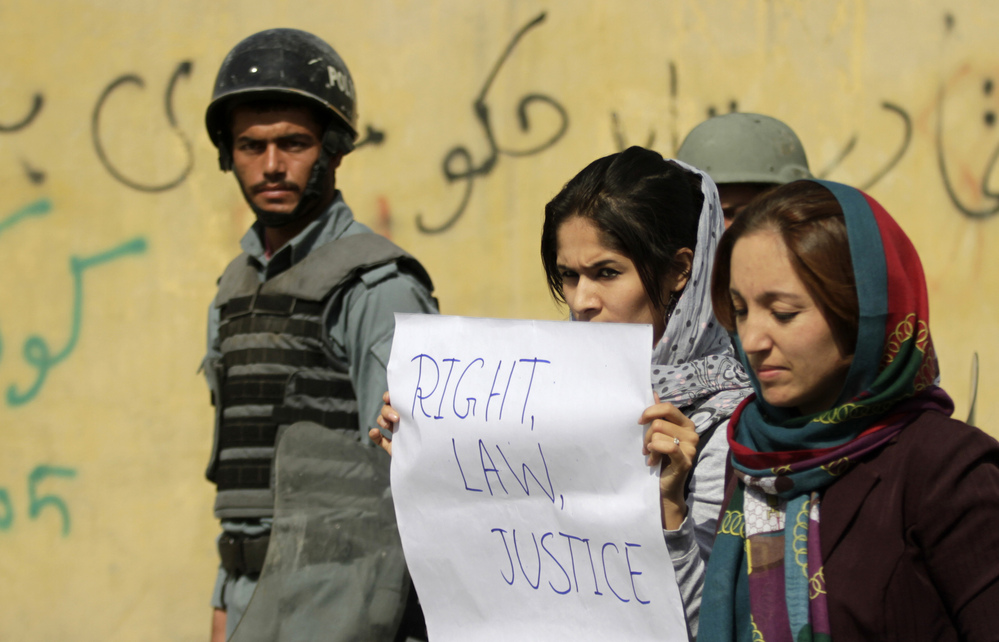 Students in Kabul protest violence against women in Kabul last fall. Afghan President Hamid Karzai issued a decree in 2009 protecting women's rights, but parliament has not passed a law making the decree permanent.