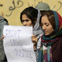 Students in Kabul protest violence against women in Kabul last fall. Afghan President Hamid Karzai issued a decree in 2009 protecting women's rights, but parliament has not passed a law making the decree permanent. Students in Kabul protest violence against women in Kabul last fall. Afghan President Hamid Karzai issued a decree in 2009 protecting women's rights, but parliament has not passed a law making the decree permanent.