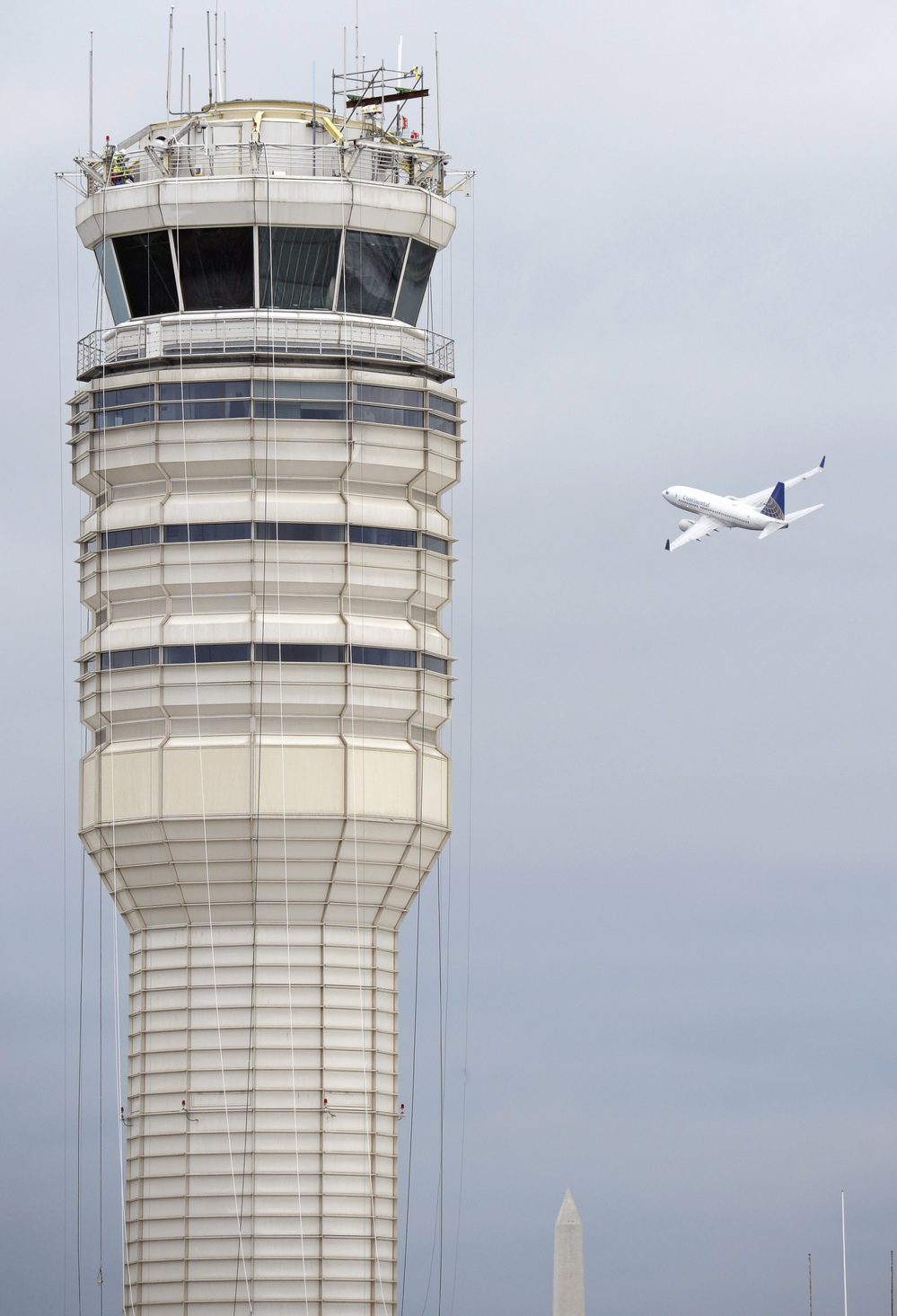 A passenger jet flies past the FAA control tower at Washington's Ronald Reagan National Airport in 2011.