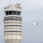 A passenger jet flies past the FAA control tower at Washington's Ronald Reagan National Airport in 2011. A passenger jet flies past the FAA control tower at Washington's Ronald Reagan National Airport in 2011.