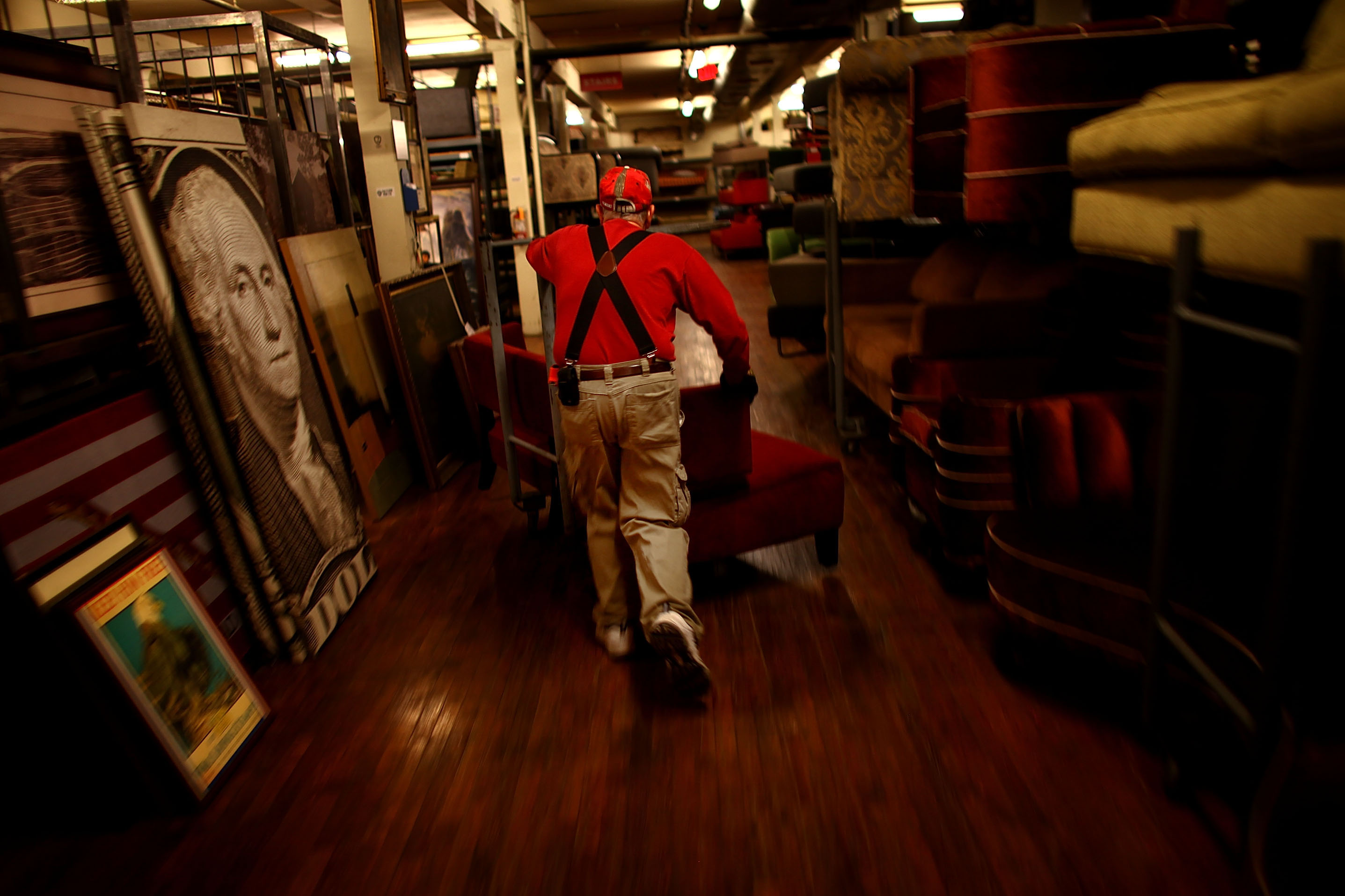 Warner Brothers worker Stephen Lampke moves furniture on the Prop House's second floor, which holds the "contemporary" items: sofas, coffee tables, end tables, bookcases, mostly middle-class workaday furniture.