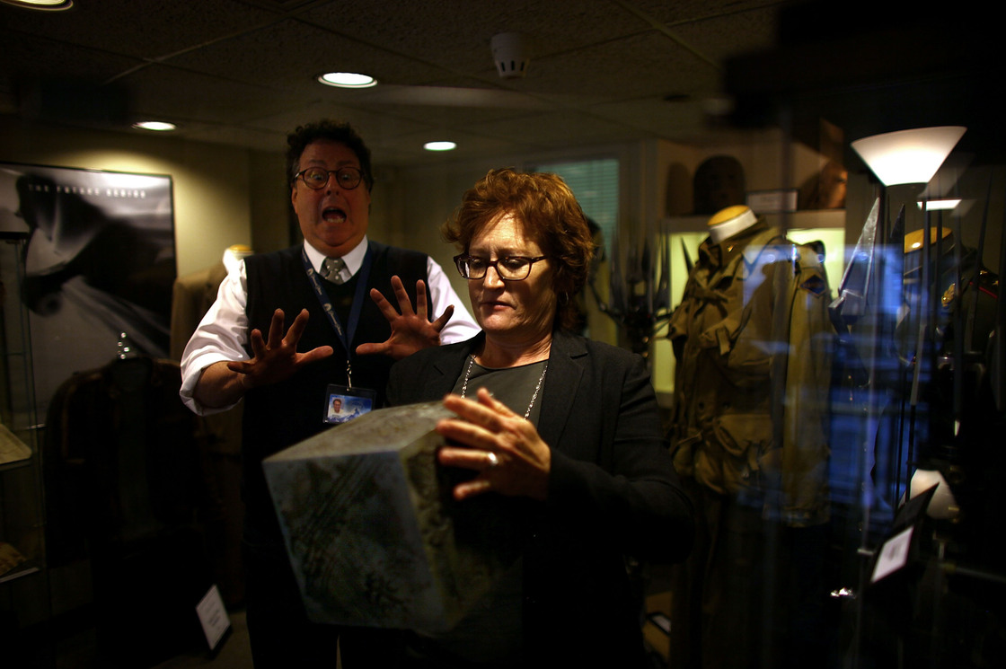 Randall Thropp, a Paramount archivist, recoils in mock fear from the power of the AllSpark as set decorator Rosemary Brandenburg takes it from the glass case. The AllSpark was used as a prop in Transformers; it may have another life in an upcoming sequel.