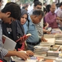 Attendees browse books on offer at the fourth annual Karachi Literature Festival.