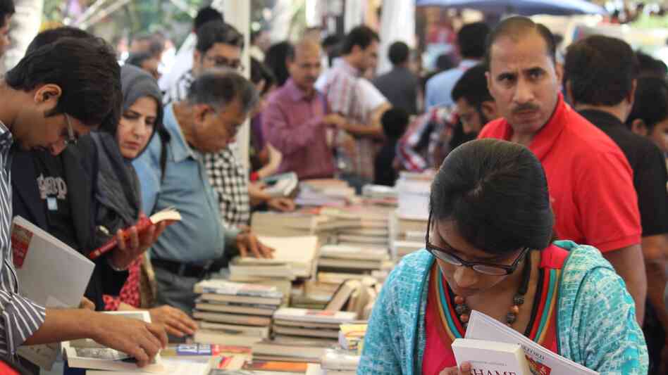 Attendees browse books on offer at the fourth annual Karachi Literature Festival.