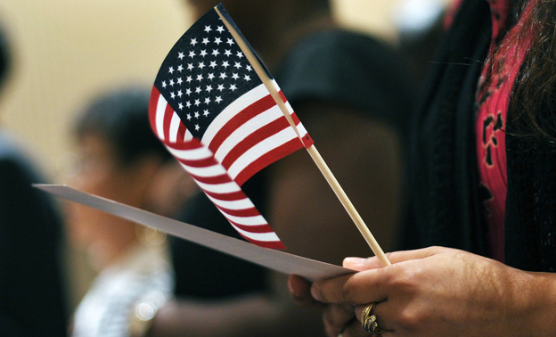 Newly sworn-in U.S. citizens recite the Pledge of Allegiance during a naturalization ceremony in Baltimore in 2012.