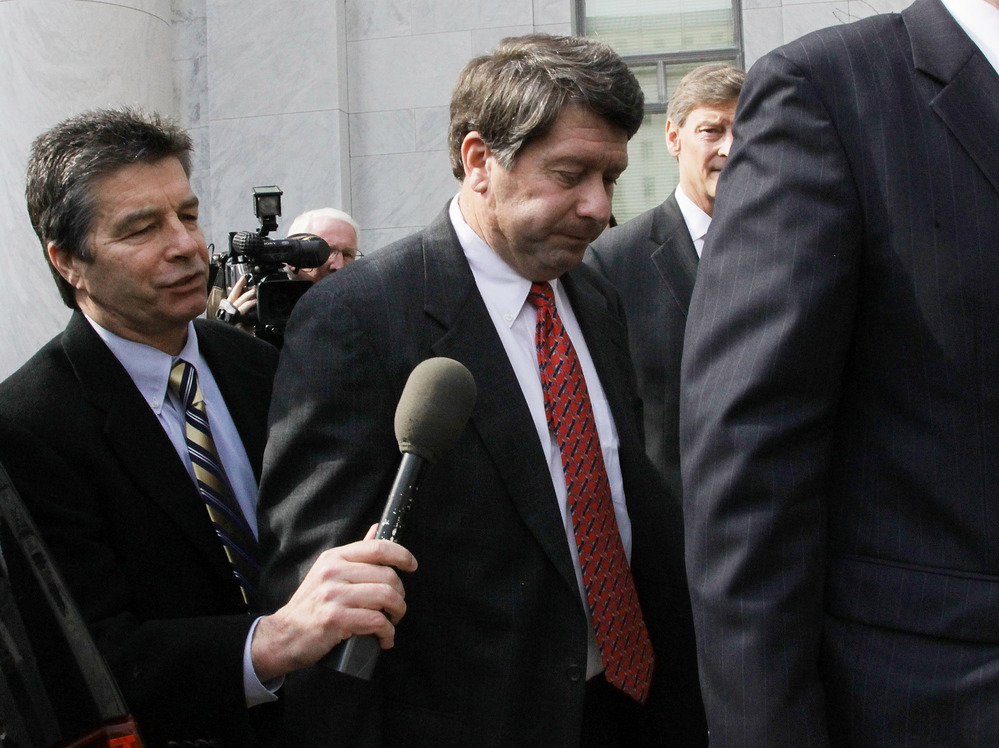 Stewart Parnell (center), former president of the now-defunct Peanut Corp. of America, is one of four executives indicted over a 2009 outbreak of salmonella.