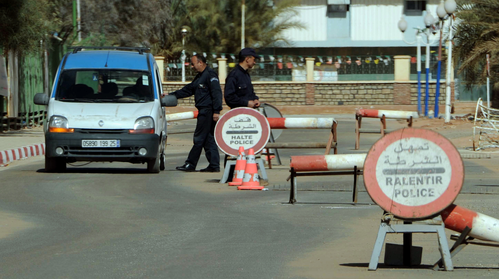 Algerian police stop cars at a checkpoint in In Amenas, deep in the Sahara near the Libyan border, on Jan. 18. Islamists took hostages at a nearby gas field in a major international incident.